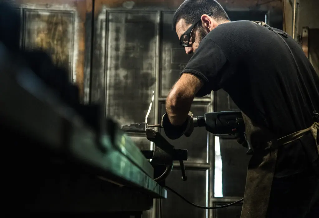 man working hard with manual tools