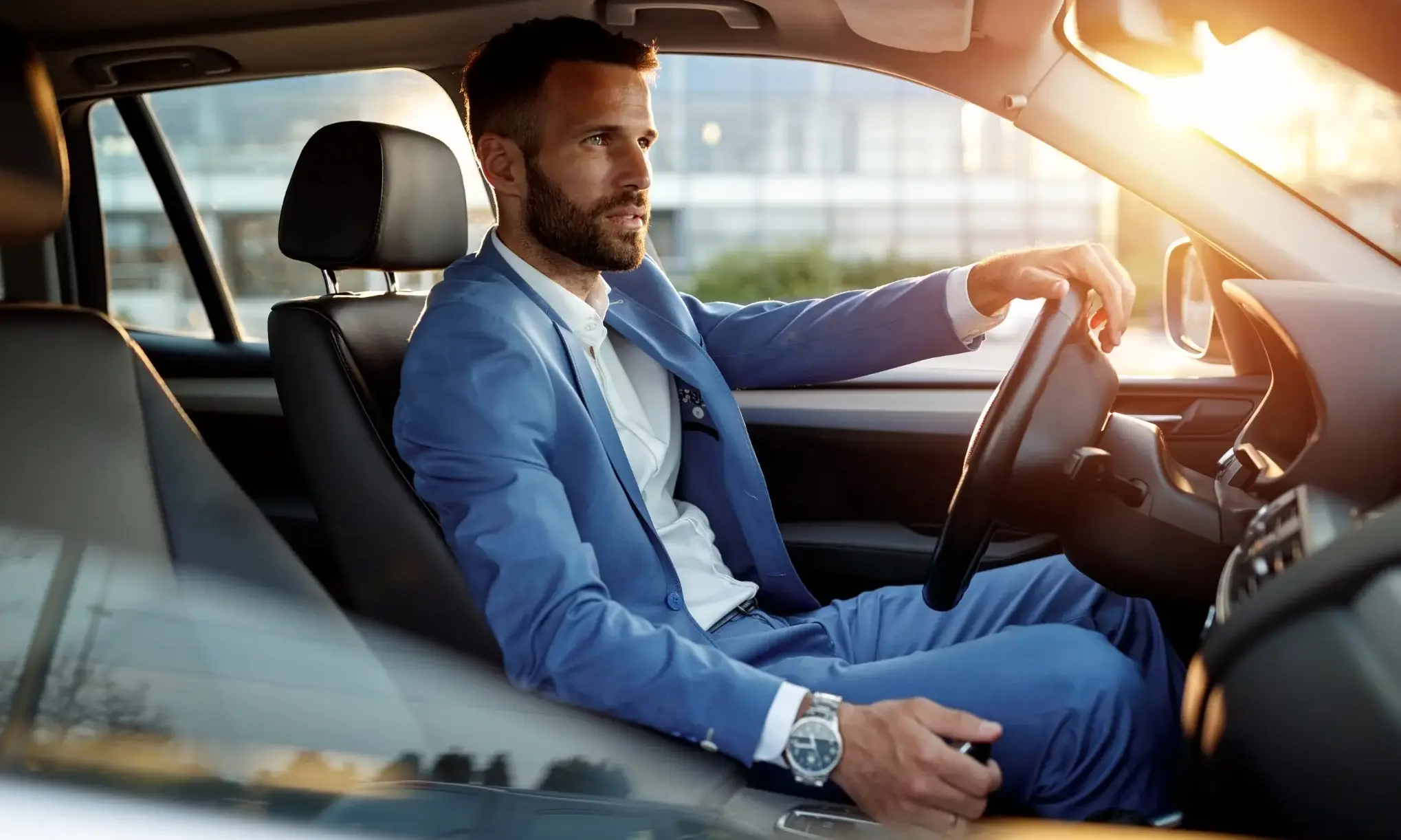 stylish man driving a car