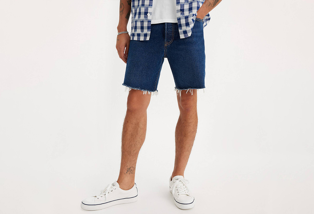 Guy Wearing Retro-Inspired Denim Shorts wiht untucked casula shirt