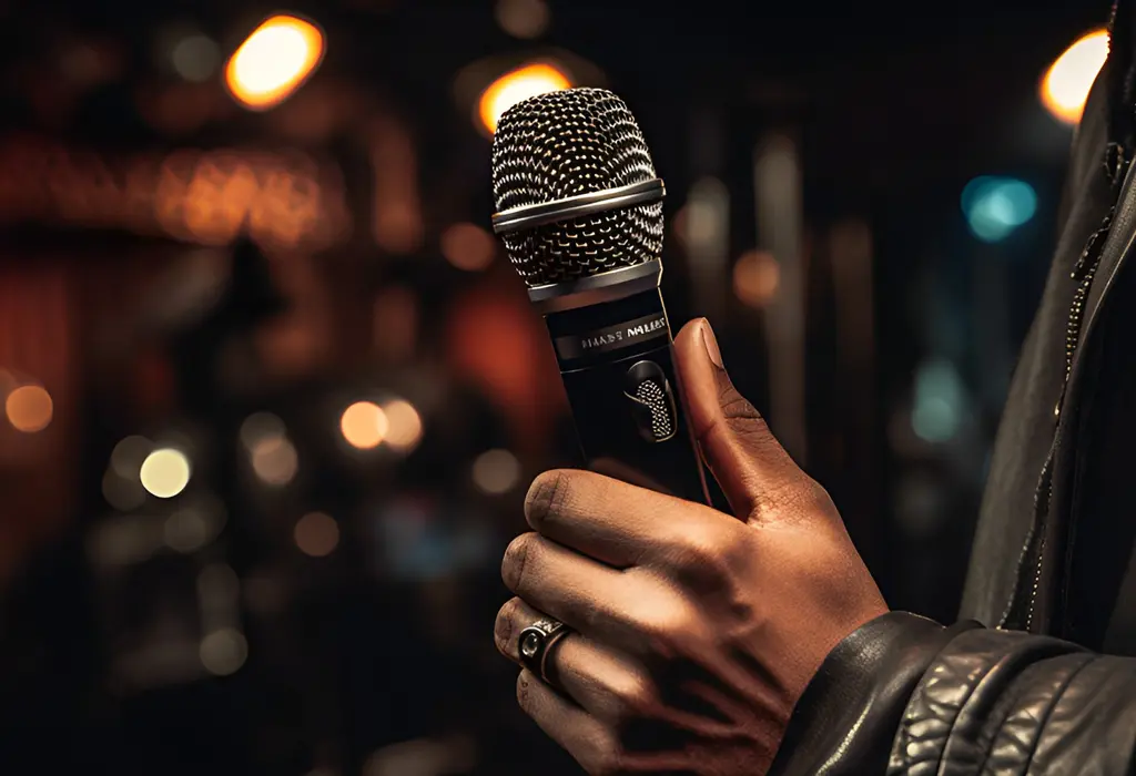 man holding microphone by his hand with a ring